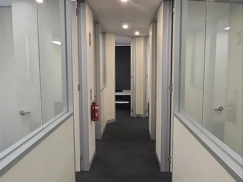 Completed commercial office suite with full-height glazed partitions