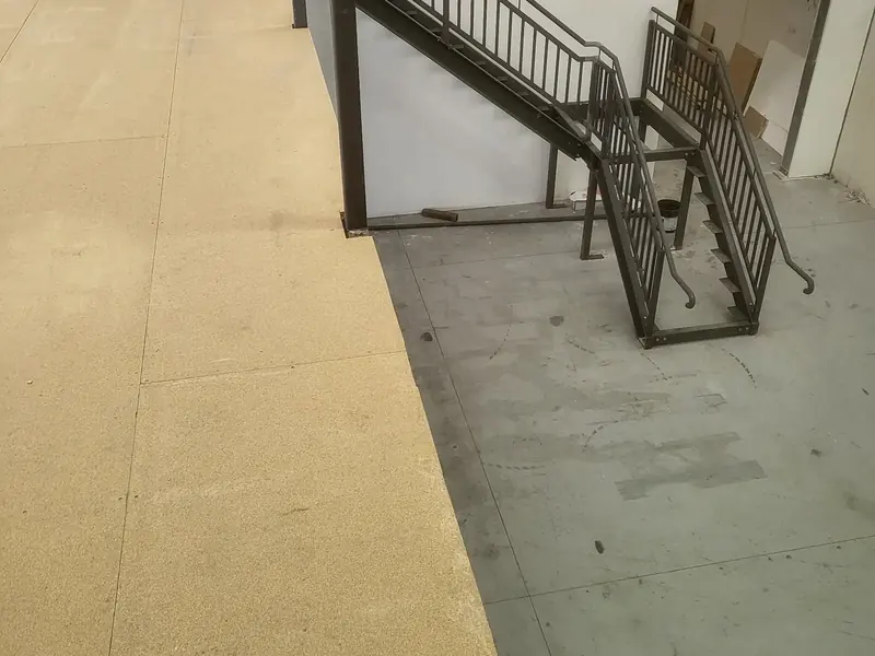 Finished mezzanine floor and staircase inside a commercial warehouse