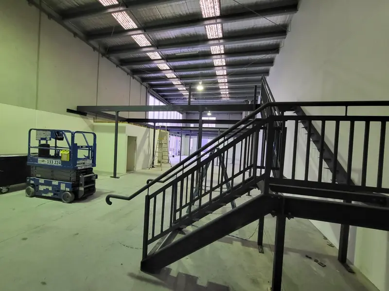 Steel staircase and structural frame for a commercial mezzanine project