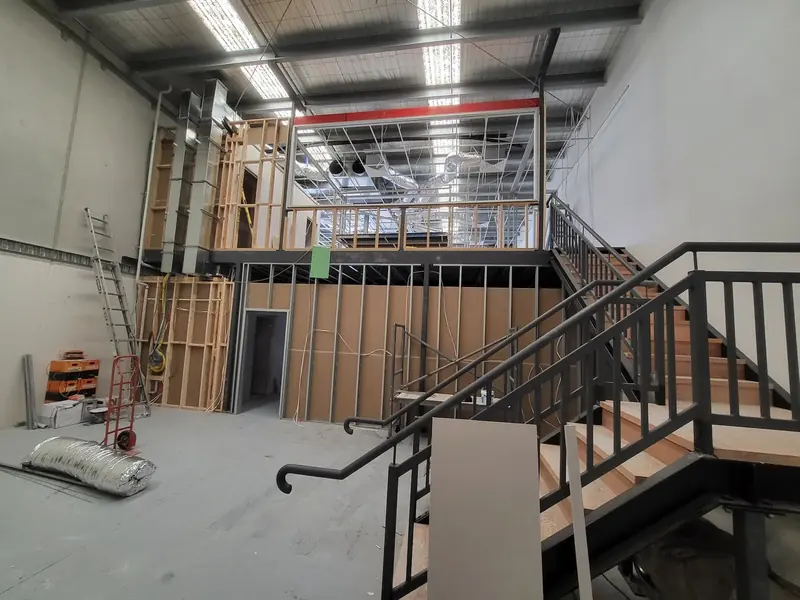 Commercial office fit-out under construction with framed internal rooms